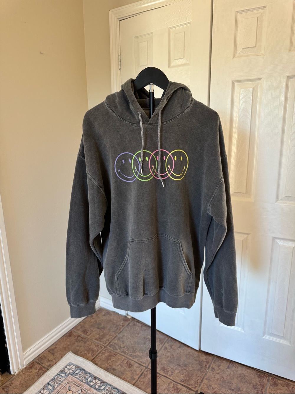 Black Pullover Hoodie with Neon Smiley Circle Graphic